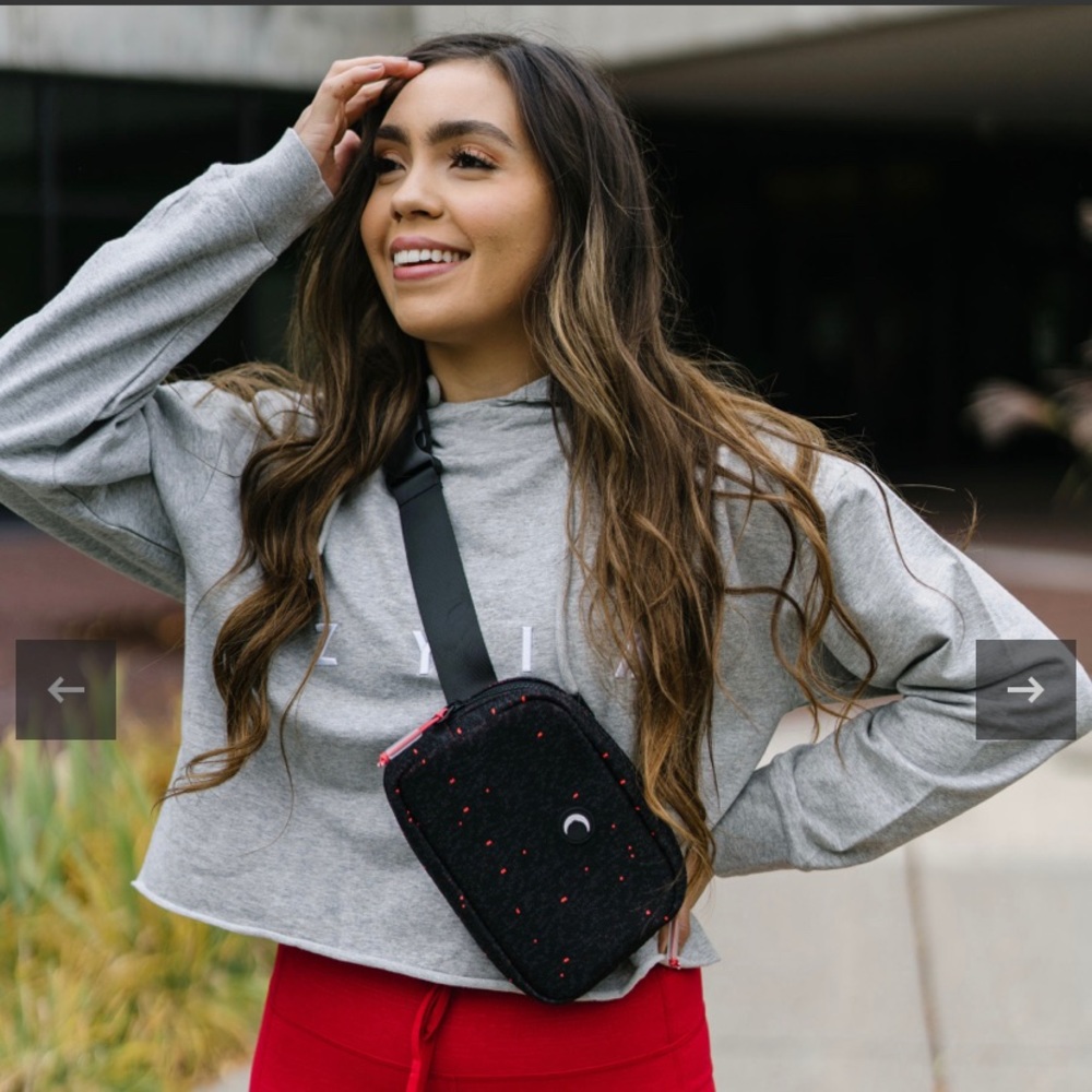 Black with speckles crossbody bag, never been used! Does not have tags attached.